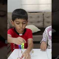 Beading activity for kids with pasta