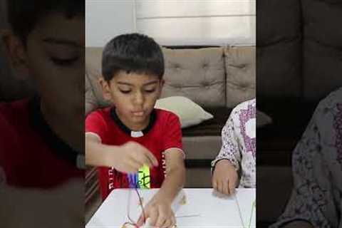 Beading activity for kids with pasta